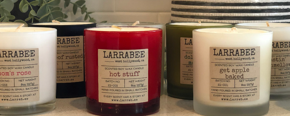 A photo banner of various Larrabee candles on a countertop